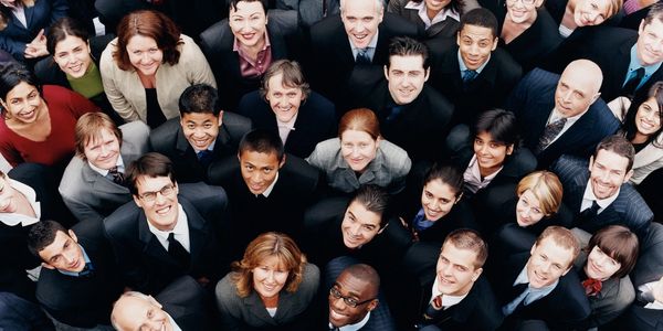 People in business suits looking up